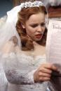 <p>We almost (but not really) wanted to see Rachel McAdams's character, Allie Hamilton, marry Lon so that we could get a better glimpse at the exquisite gown she was planning to wear for the ceremony. The 1940s wedding dress featured front buttons, an illusion neckline, and lots of lace.<br></p>