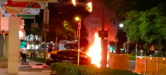 A taxi caught fire at Bras Basah Road. Photo: Kulbir Singh/Facebook