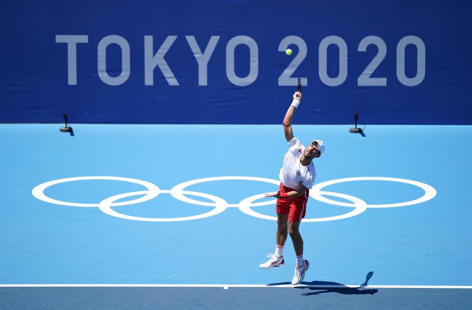 Novak Djokovic, seeking to become the first man in history to win a Golden Slam of all four grand slam titles and Olympic singles gold in the same year, trains in Tokyo (Mike Egerton/PA) (PA Wire)