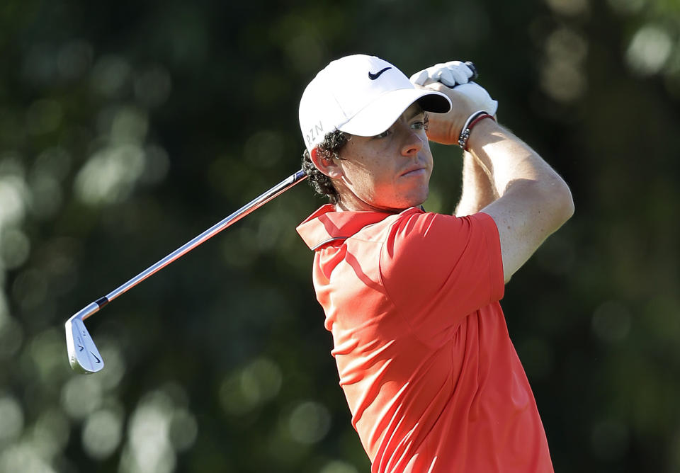 \Rory McIlroy, of Northern Ireland, watches his shot on the first hole during a practice round of the Cadillac Championship golf tournament, Wednesday, March 5, 2014, in Doral, Fla. (AP Photo/Wilfredo Lee)