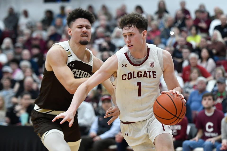 Colgate sophomore Brady Cummins, right, who led the York High School boys basketball team to the Class A championship game in 2020, is defended by Lehigh guard Keith Higgins Jr. during the second half of Wednesday's Patriot League championship game. Cummins scored a career-high 19 points and Colgate secured a bid in next week's NCAA Men's Tournament with a 74-55 win
