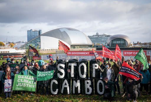 Activists from Friends of the Earth during a demonstration calling for an end to all new oil and gas projects in the North Sea, starting with the proposed Cambo oil field, outside the UK Government’s Cop26 hub during the Cop26 summit in Glasgow. Picture date: Sunday November 7, 2021. (PA)