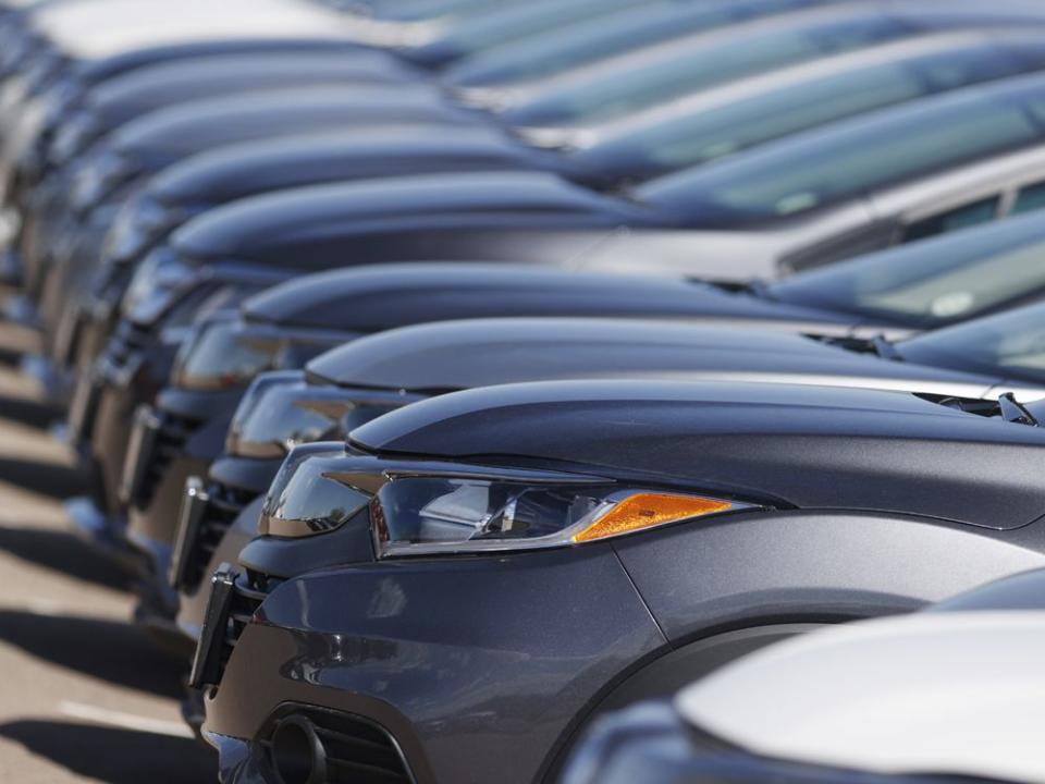  A row of cars at a Honda dealership.