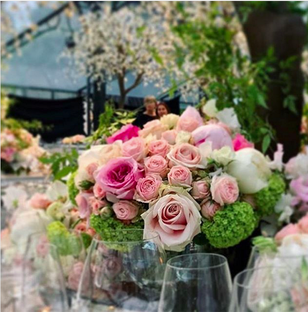 Pretty rose centerpieces were places on each table. Photo: Instagram