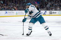 San Jose Sharks center Luke Kunin (11) shoots on goal but is blocked by the the Seattle Kraken during the second period of an NHL hockey game, Thursday, April 11, 2024, in Seattle. (AP Photo/John Froschauer)