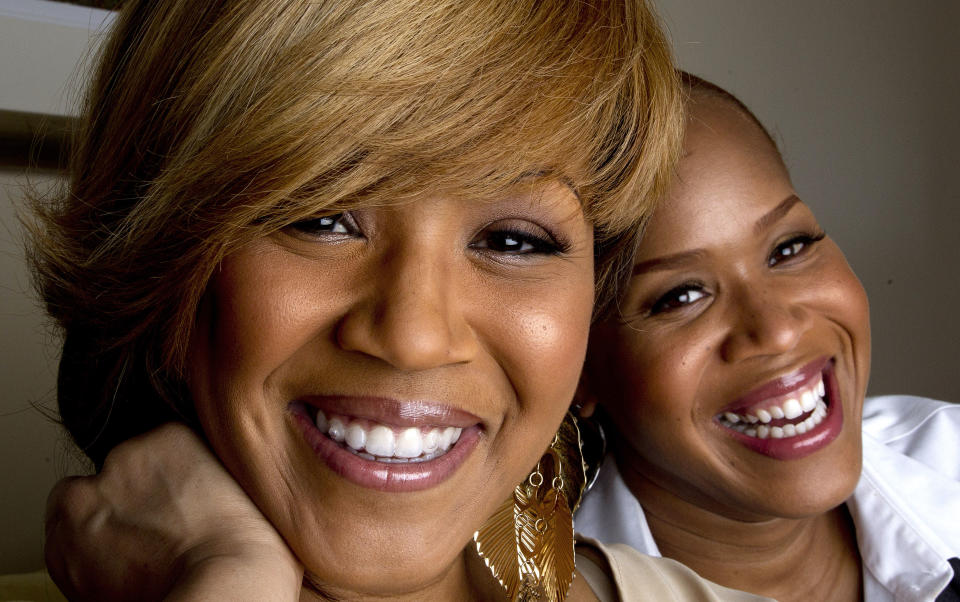 In this March 22, 2012 photo, Erica Campbell, left, and her sister Tina Campbell, of the gospel group Mary Mary pose for a portrait in Atlanta. The two plan to star in a reality show based on their lives as recording artists and mothers. The Grammy-winning singers, sisters Erica and Tina Campbell, offer a glimpse into the duo's lives through their new reality show, "Mary Mary," which debuts this week on WEtv. (AP Photo/John Bazemore)