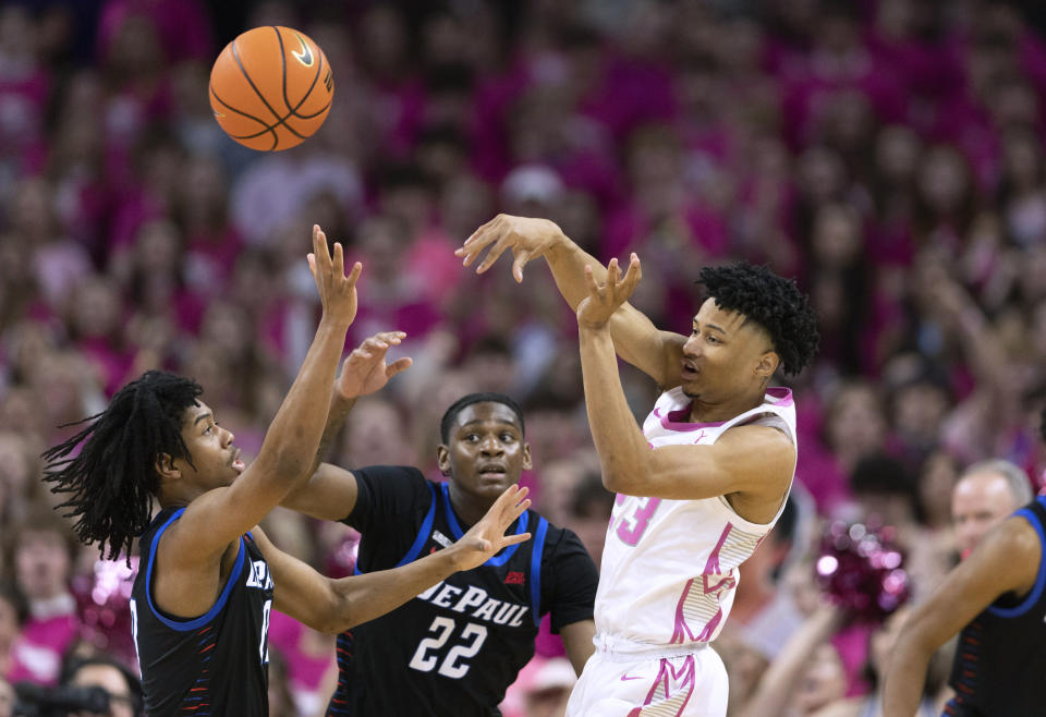 Creighton's Trey Alexander, right, passes the ball over DePaul's Jaden Henley, left, and Elijah Fisher during the first half of an NCAA college basketball game Saturday, Jan. 27, 2024, in Omaha, Neb. (AP Photo/Rebecca S. Gratz)