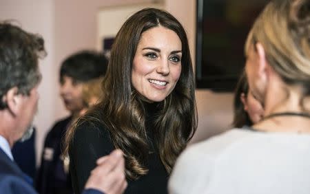 FILE PHOTO: Catherine, Duchess of Cambridge speaks with staff members during a visit to the Nelson trust women's centre in Gloucester, Britain November 4, 2016. REUTERS/Richard Pohle/Pool