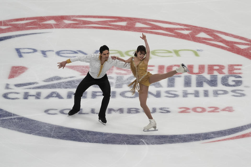 Emily Chan, right, and Spencer Howe, left, compete during the championship pairs short program at the U.S. figure skating championships Thursday, Jan. 25, 2024, in Columbus, Ohio. (AP Photo/Sue Ogrocki)