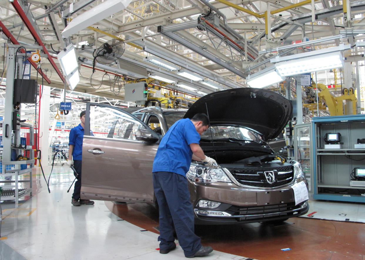 Employees work at a production line inside a factory of Saic GM Wuling, in Liuzhou, Guangxi Zhuang Autonomous Region, China, June 19, 2016. REUTERS/Norihiko Shirouzu