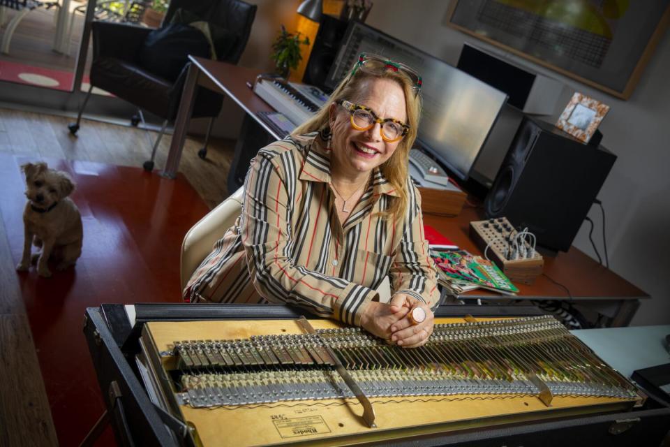 Laura Karpman sits at a workspace in her home for a portrait.