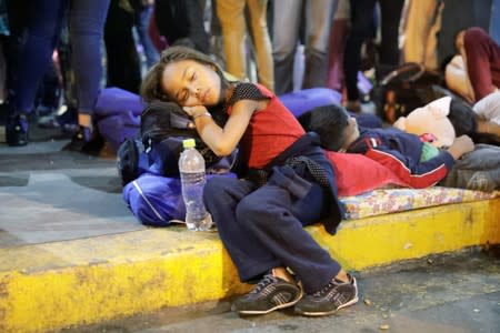 A Venezuelan migrant child rests at the Binational Border Service Center of Peru in Tumbes