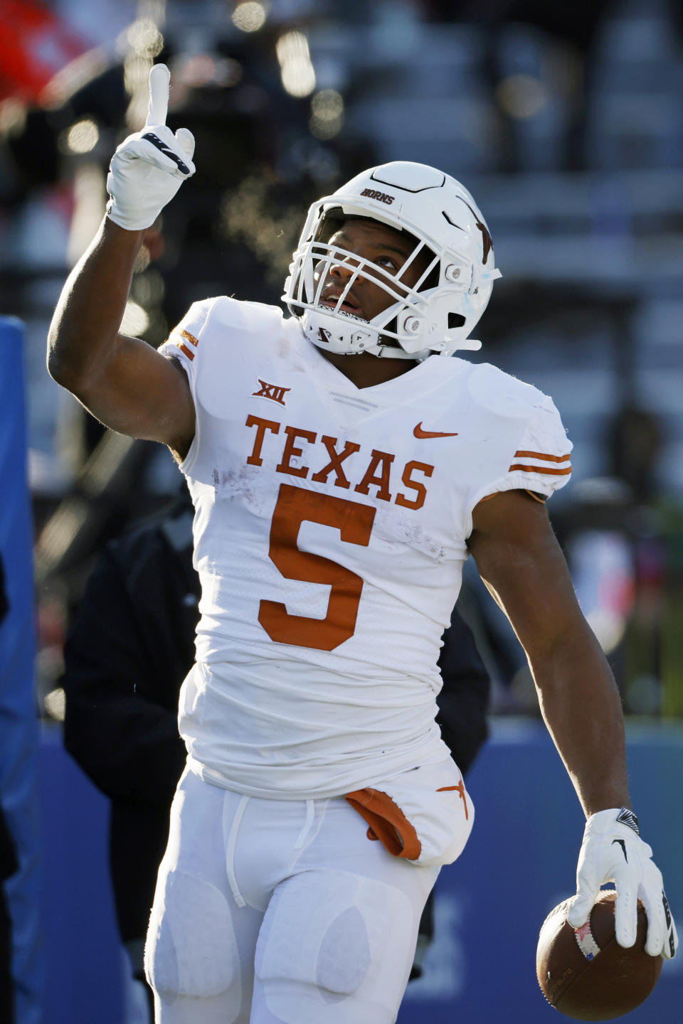 Texas running back Bijan Robinson celebrates after scoring a touchdown against Kansas during the second quarter of an NCAA college football game on Saturday, Nov. 19, 2022, in Lawrence, Kan. (AP Photo/Colin E. Braley)