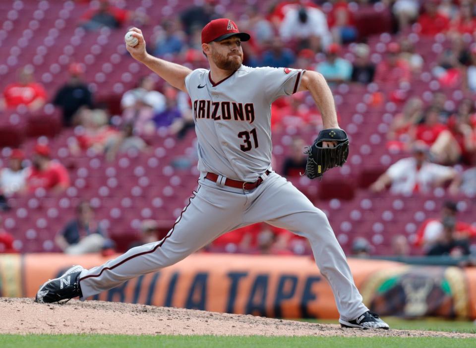 Jun 9, 2022; Cincinnati, Ohio, USA; Arizona Diamondbacks relief pitcher Ian Kennedy (31) throws a pitch against the Cincinnati Reds during the ninth inning at Great American Ball Park.