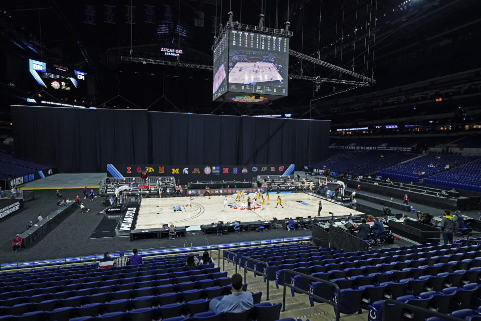 Minnesota and Northwestern play at Lucas Oil Stadium during the first half of an NCAA college basketball game at the Big Ten Conference tournament, Wednesday, March 10, 2021, in Indianapolis. Lucas Oil Stadium is one of six venues hosting NCAA Tournament games later this week. (AP Photo/Darron Cummings)