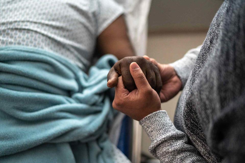 <p>Getty</p> A stock image of people in a hospital. 