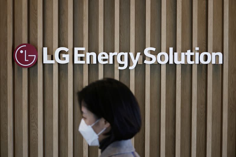 An employee walks past the logo of LG Energy Solution at its office building in Seoul