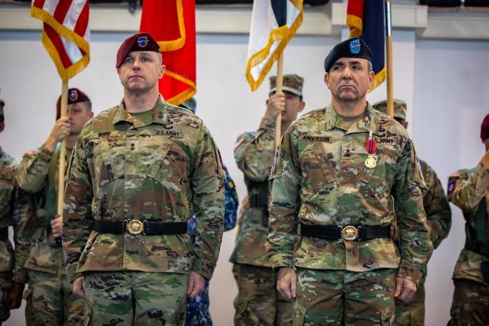 Maj. Gen. Pat Work, left, commander of the 82nd Airborne Division and "Task Force 82", and Maj. Gen. Gregory K. Anderson, commander of the 10th Mountain Division and "Task Force Mountain", stand at attention during a Dec. 15, 2023, transfer of authority ceremony hosted by the U.S. Army’s V Corps at Mihail Kogalniceanu Air Base, Romania.