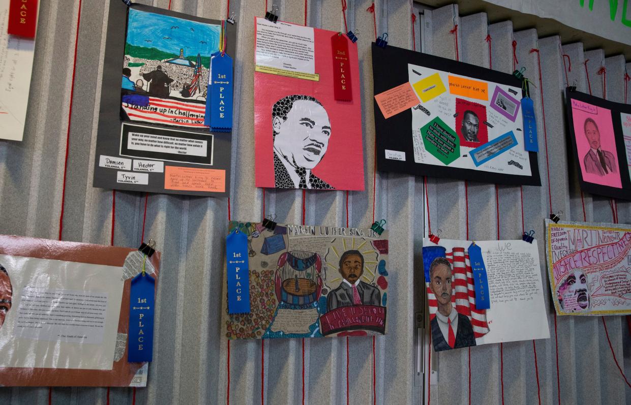 Winners of the 25th annual Martin Luther King Jr. art contest hang on the wall at Springfield High School for MLK Day March in Springfield Monday, Jan. 16, 2023. 