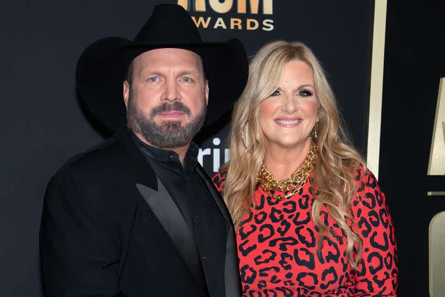 <p>SUZANNE CORDEIRO/AFP via Getty</p> Garth Brooks and Trisha Yearwood in Frisco, Texas in May 2023