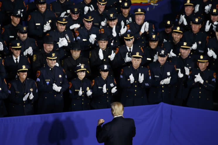 Law enforcement officers with President Donald Trump