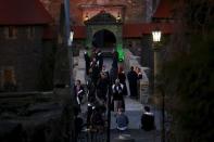 Participants gather in front of the castle before the role play event at Czocha Castle in Sucha, west southern Poland April 9, 2015. REUTERS/Kacper Pempel