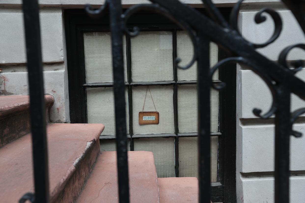 A shade is drawn and a small closed sign hangs in the window of The Book Lady Bookstore on Monday, April 22, 2024.