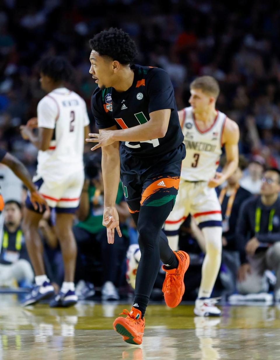 Miami Hurricanes guard Nijel Pack (24) reacts after hitting a three pointer against the Connecticut Huskies during the first half of the Men’s Basketball Championship National Semifinal at NRG Stadium in Houston, Texas on Saturday, April 1, 2003.