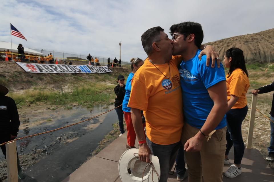 Partners Felipe and Ricardo had not seen each other for a year when they met in the middle of the Rio Grande to hug and get engaged, during the 10th Hugs Not Walls event at the borders of Texas, New Mexico, and Chihuahua. Luis Torres/ special for El Paso Times. 