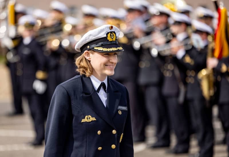 Frigate Captain Inka von Puttkamer stands at the handover of command of the 3rd Minesweeper Squadron in the naval port of Kiel. Von Puttkamer is the first woman to take command of a German Navy combat unit. Axel Heimken/dpa