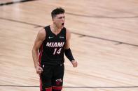 Miami Heat guard Tyler Herro (14) celebrates a basket against the Boston Celtics late in the second half of Game 4 of an NBA basketball Eastern Conference final, Wednesday, Sept. 23, 2020, in Lake Buena Vista, Fla. (AP Photo/Mark J. Terrill)