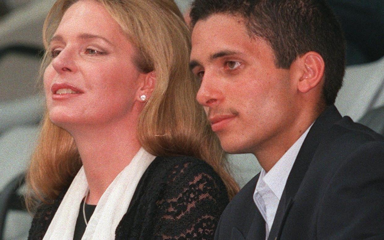 Prince Hamzah bin Al Hussein, right, with his mother Queen Noor of Jordan in 1999 -  JAMAL NASRALLAH/AFP