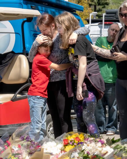 Cody Welling, brother, Kelly Welling, mother and sister Hannah Welling visit the sidewalk memorial Westlake High School