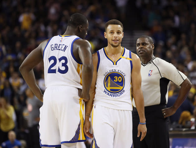 Draymond Green and Stephen Curry cannot believe it. (Getty Images)