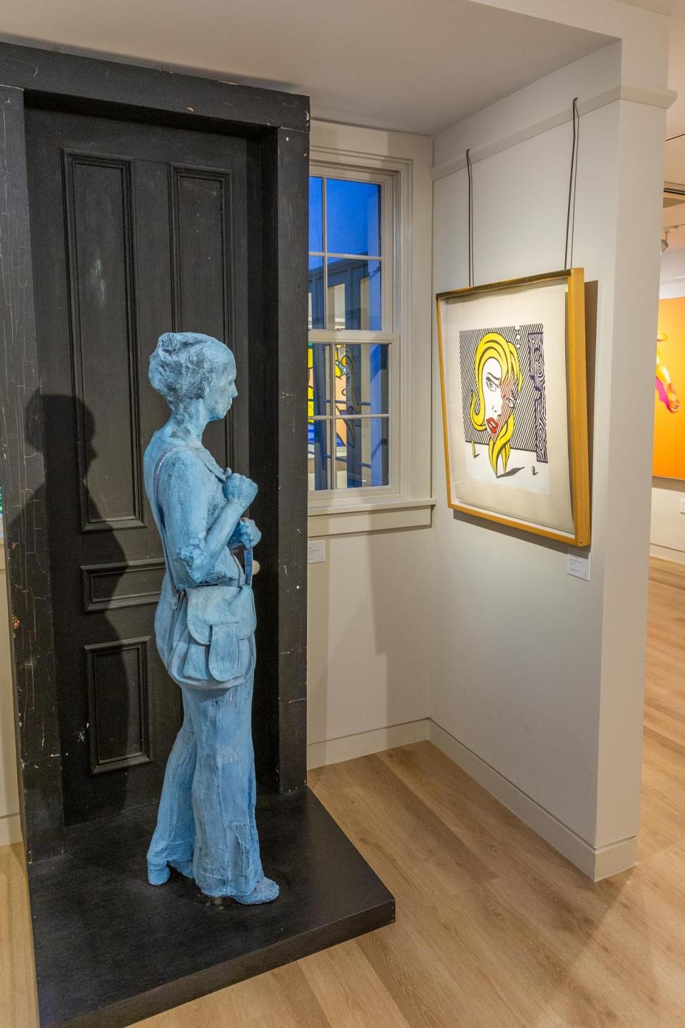 George Segal's 'Blue Girl in Front of Black Door' seems to run toward Roy Lichtenstein's 'Blonde' as part of the 'Figurative Masters of the Americas' series at the Ann Norton Sculpture Gardens.