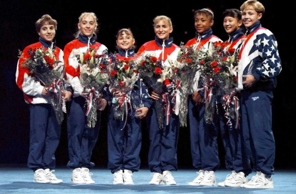 BOSTON, :  The 1996 US Women's Gymnastic's Olympic Team (L-R) Kerri Strug, Jaycie Phelps, Dominique Moceanu, Shannon Miller, Dominique Dawes, Amy Chow and Amanda Borden pose after the finals of the Women's Optionals at the 1996 US Olympic Gymnastic Team Trials at the Fleet Center in Boston 30 June. The seven women picked will represent the US at the1996 Summer Olympics in Atlanta. (ELECTRONIC IMAGE)   AFP PHOTO  John Mottern (Photo credit should read JOHN MOTTERN/AFP/Getty Images)