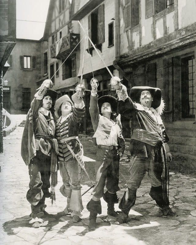 Left to right: Léon Bary, Eugene Pallette, Douglas Fairbanks, and George Siegmann in the American film The Three Musketeers (1921) - publicity still