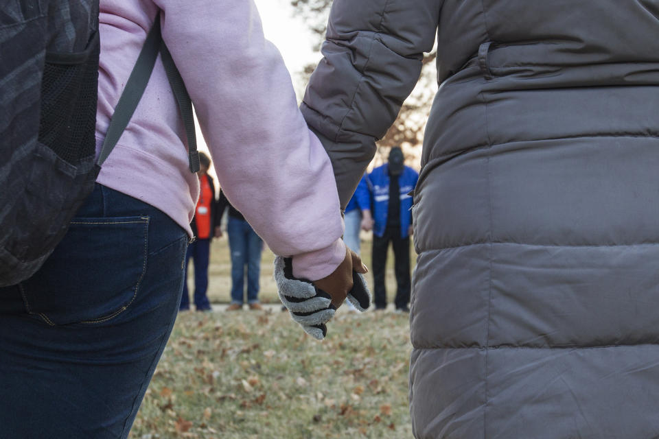 <p>Students and community members hold hands in prayer before classes at Paducah Tilghman High School in Paducah, Ky., Wednesday, Jan. 24, 2018. The gathering was held for the victims of the Marshall County High School shooting on Tuesday. (Photo: Ryan Hermens/The Paducah Sun via AP) </p>