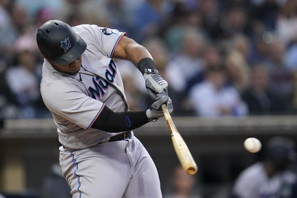 Miami Marlins' Jesus Aguilar hits an RBI-single during the third inning of a baseball game against the San Diego Padres, Thursday, May 5, 2022, in San Diego. (AP Photo/Gregory Bull)