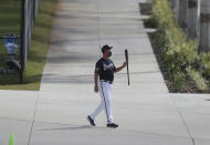 Atlanta Braves Hall of Famer Chipper Jones leaves the batting cages twirling his bat after a morning session of batting practice during baseball spring training, Wednesday, Feb. 24, 2021, in North Port, Fla. (Curtis Compton/Atlanta Journal-Constitution via AP)