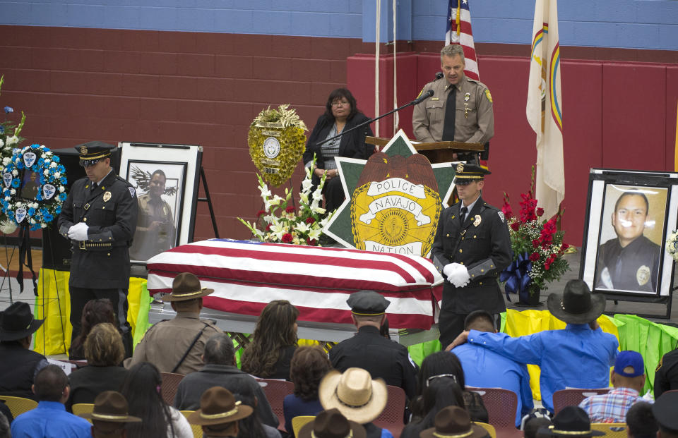 FILE - In this March 16, 2017 file photo Chaplain Mark Morris speaks during a memorial service for fallen Officer Houston Largo at Rehoboth Christian School in Gallup, N.M. The man who gunned down a tribal police officer in a remote corner of the nation's largest American Indian reservation has been sentenced to 30 years in federal prison.(Cayla Nimmo/Gallup Independent via AP,File)