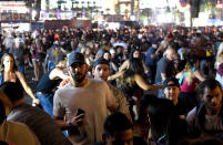 <p>People flee the Route 91 Harvest country music festival grounds after a active shooter was reported on Oct. 1, 2017 in Las Vegas. (Photo: David Becker/Getty Images) </p>