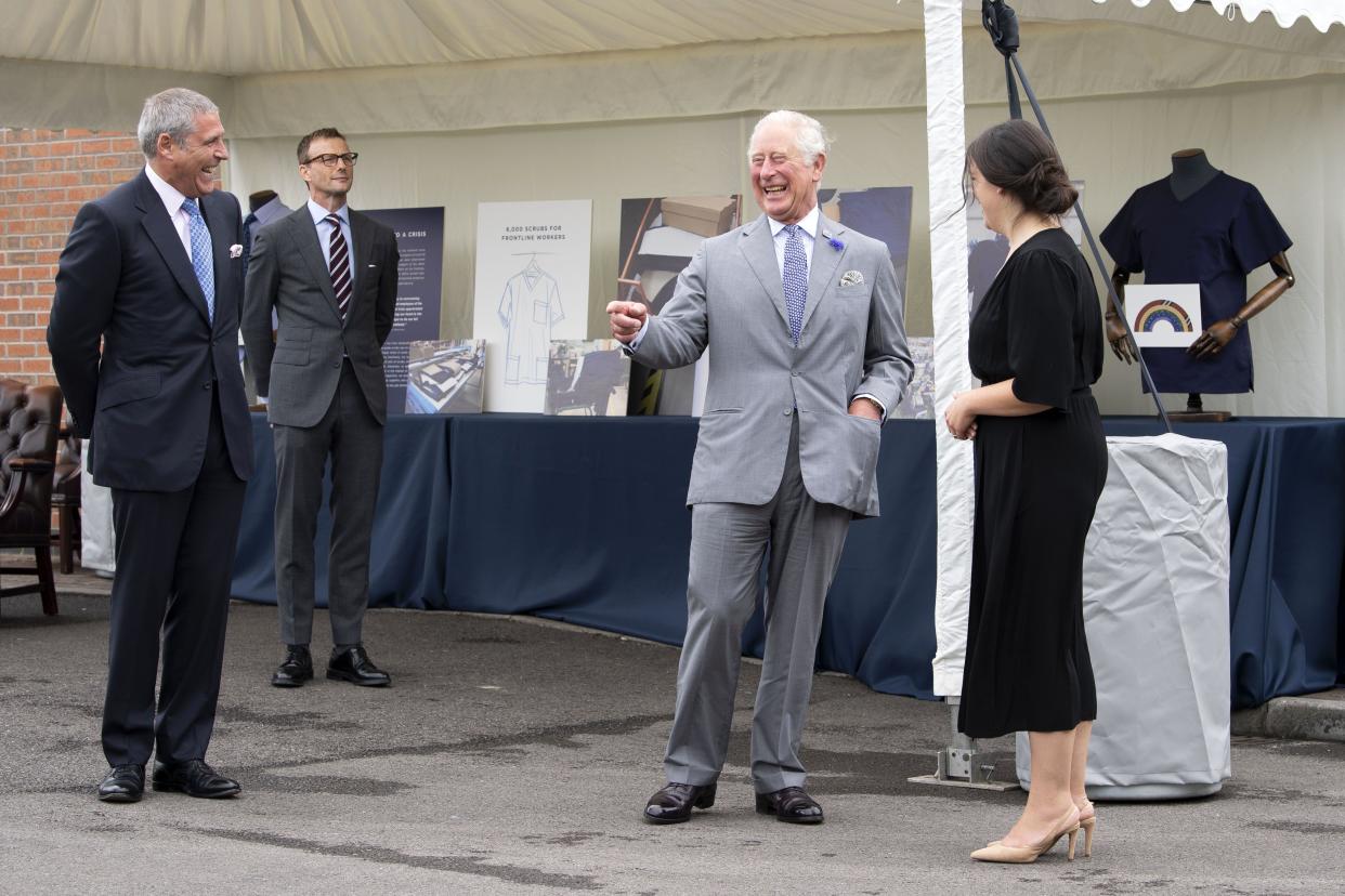 Britain's Prince Charles, Prince of Wales reacts during his visit to the Turnbull & Asser shirt factory in Gloucester, southwest England on July 9, 2020. - At the height of the COVID-19 pandemic, the shirt manufacturer switched their entire production line to making scrubs for Britain's NHS (National Health Service). (Photo by Matthew Horwood / POOL / AFP) (Photo by MATTHEW HORWOOD/POOL/AFP via Getty Images)