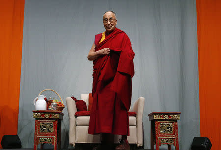 Tibetan spiritual leader the Dalai Lama arrives for a public talk at the Fraport Arena in Frankfurt May 14, 2014. REUTERS/Ralph Orlowski/Files