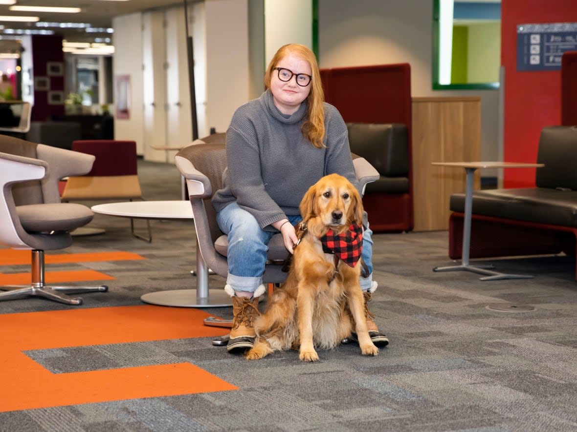 Georgia Pike, pictured here with her seeing eye dog Maggie, says she's travelled in and out of Toronto Pearson Airport many times, but her latest experience prompted her to come forward about 'a system that discriminates against people with disabilities.' (Michael Wilson/CBC - image credit)