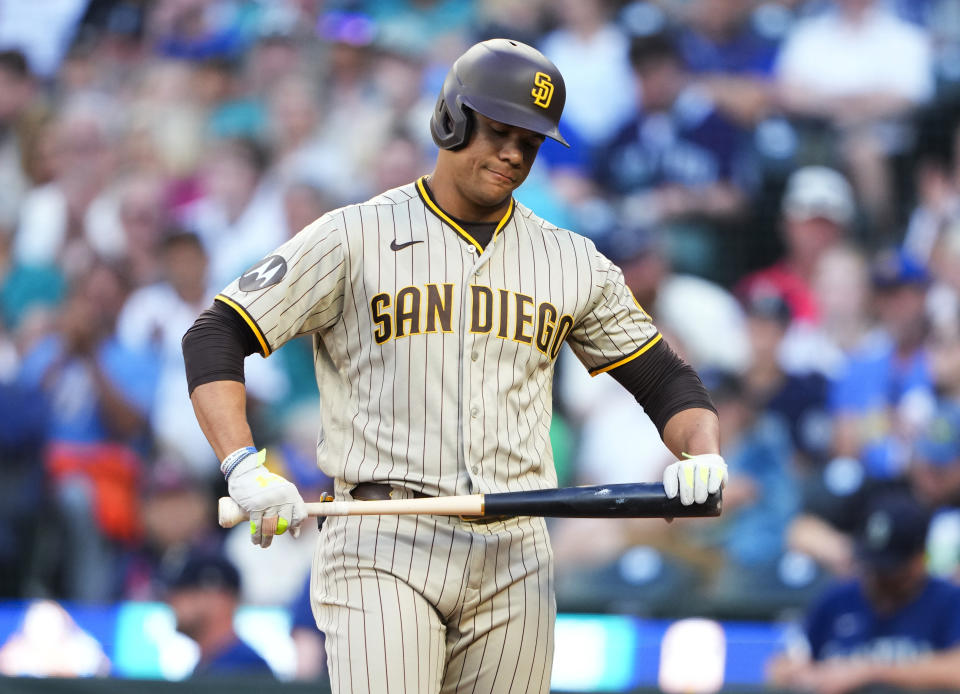 San Diego Padres' Juan Soto holds his bat after striking out against the Seattle Mariners during the fourth inning of a baseball game Tuesday, Aug. 8, 2023, in Seattle. (AP Photo/Lindsey Wasson)