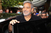<p>George Clooney smiles for the fans while promoting new film <em>The Tender Bar,</em> which he directed, at the London Film Festival on Oct. 9. </p>