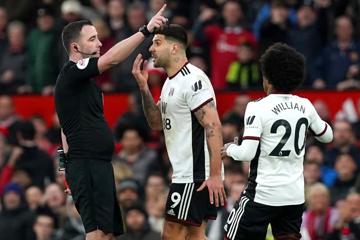 Aleksandar Mitrovic (centre) shoved referee Chris Kavanagh (left) and was sent off at Old Trafford (Martin Rickett/PA) (PA Wire)