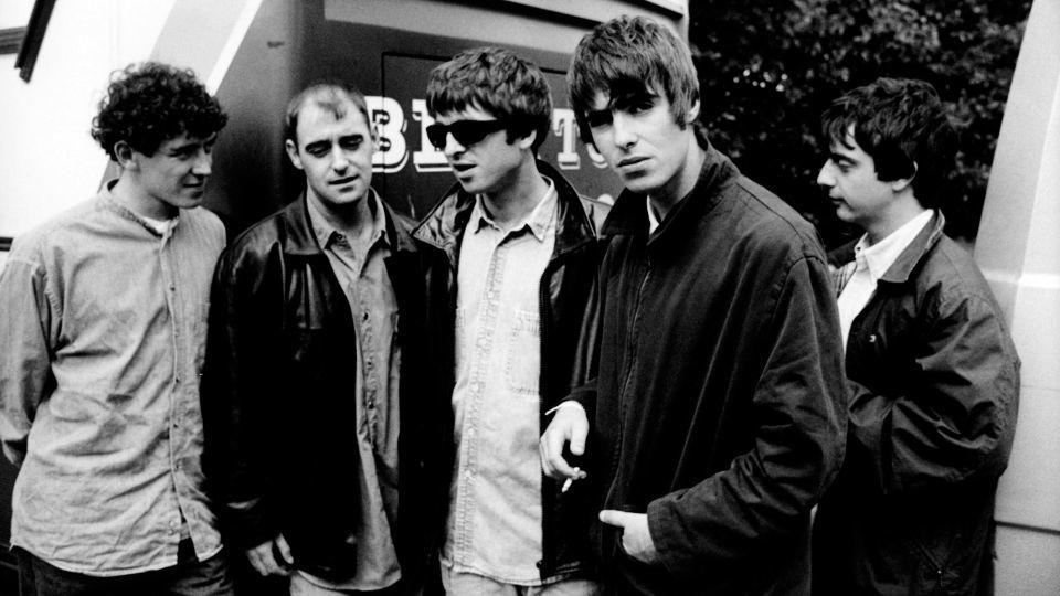 In this January 1994 photo, Noel and Liam Gallagher, center pose with other Oasis band members Tony McCarroll, Paul Arthurs and Paul McGuigan in the Netherlands.  - Michel Linssen/Redferns/Getty Images