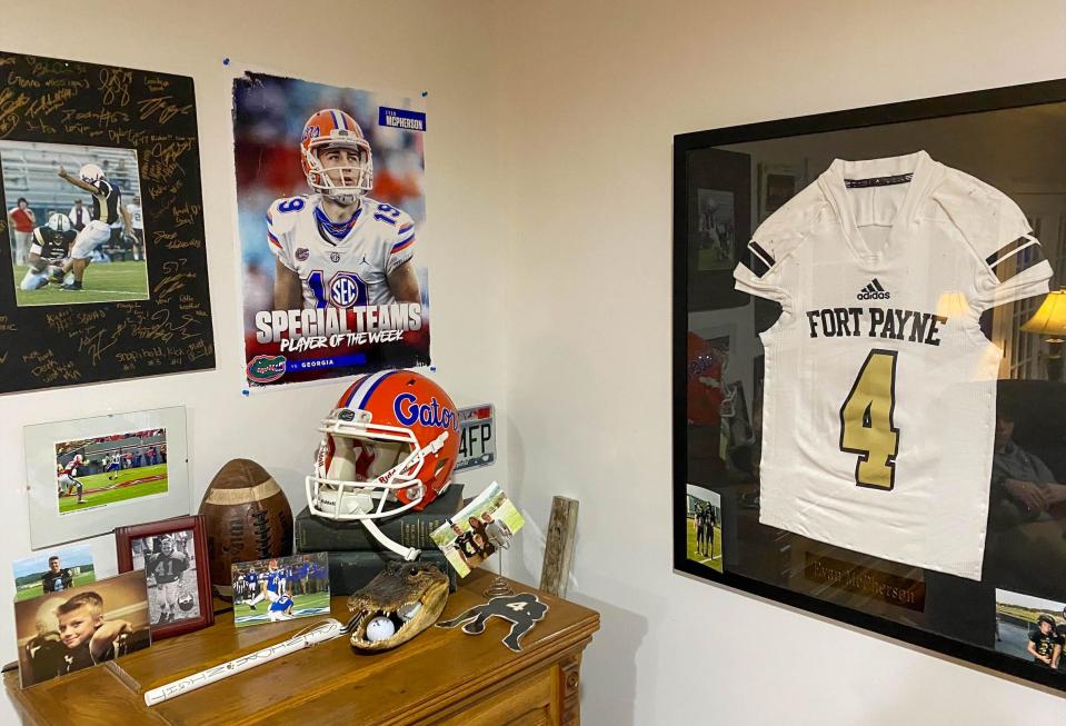Evan McPherson's memorabilia hangs in his parents' Fort Payne house. McPherson played high school football at Fort Payne and then at Florida before being drafted by Cincinnati.